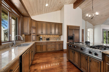 a farmhouse kitchen with wood floors and accents