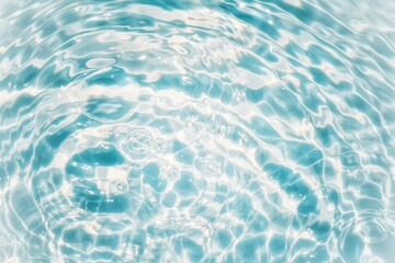 Blue water with ripples on the surface. Defocus blurred transparent blue colored clear calm water surface texture with splashes and bubbles. Water waves with shining pattern texture background texture