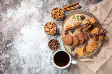 top view yummy sweet biscuits with cup of coffee on light background color cocoa sugar tea cake pie cookie sweet
