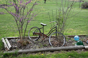 Fototapeta na wymiar Vintage Bicycle Decoration in a Garden