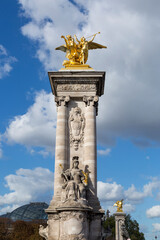 Fototapeta na wymiar Paris. Statues at Pont Alexandre III, along River Seine.