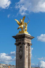 Fototapeta na wymiar Paris. Statue of Pegasus on Pont Alexandre III, along River Seine.