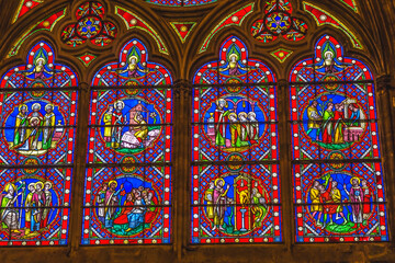 Fototapeta na wymiar Colorful medieval stained glass, Bayeux Cathedral, Bayeux, Normandy, France. Catholic church consecrated in 1077
