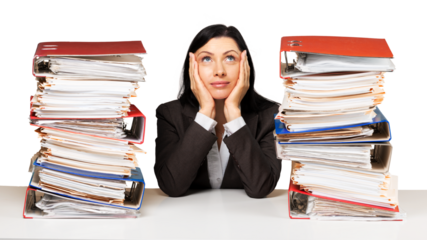 Portrait of an Employee Behind a Stack of Folders Looking Up