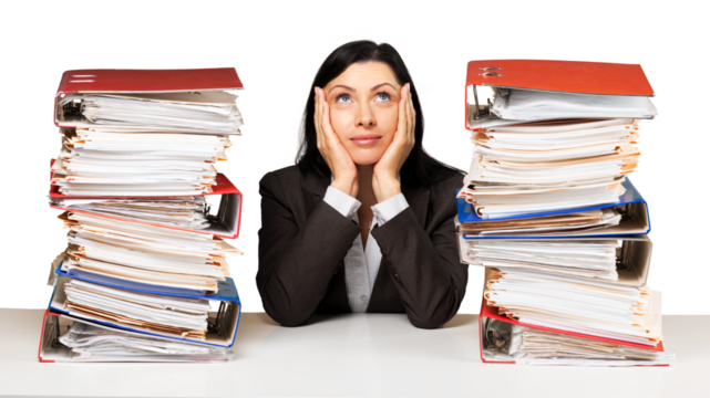 Portrait of an Employee Behind a Stack of Folders Looking Up