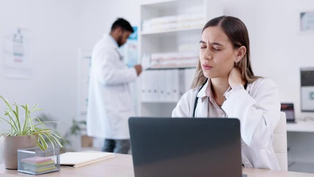Laptop, healthcare and neck pain with a doctor woman at work in a hospital for innovation or research. Computer, medical and sore with a medicine professional suffering from stiff back in a clinic