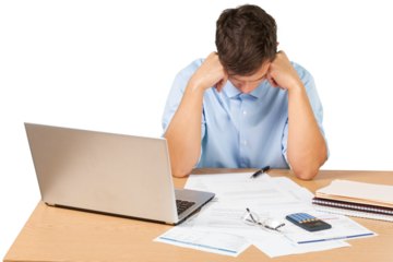 Portrait of a Desperate Businessman with Financial Figures and Laptop