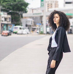 white curly brazilian business woman empowered executive 