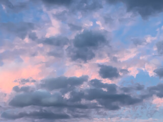 Naklejka na ściany i meble lovely fluffy white pink blue and grey clouds in the sky above Sydney NSW Australia at sunset
