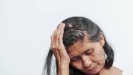 Close up older elderly asian chinese woman gray hair worry cancer worry about hair loss