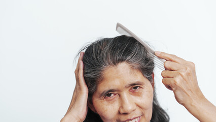 Close up older elderly asian chinese woman gray hair worry cancer worry about hair loss