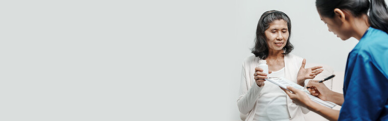 Obraz premium Senior older elderly patient asian grandmother woman with nurse consulting, safety and support of help, trust of breast cancer awareness, encourage