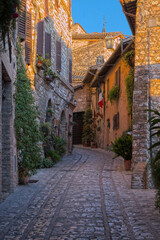 Italy, Umbria. Cobblestone street in the town of Spello.