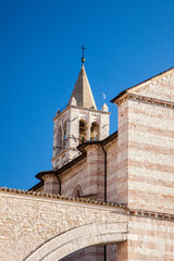 Fototapeta na wymiar Italy, Umbria, Assisi. Bell tower of the Basilica di Santa Chiara.