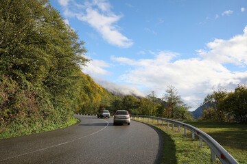 Picturesque view of road with cars in mountains