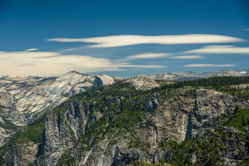 Half Dome Peeks Over The Ridge Of Sentinel Dome Below Smooth Clouds