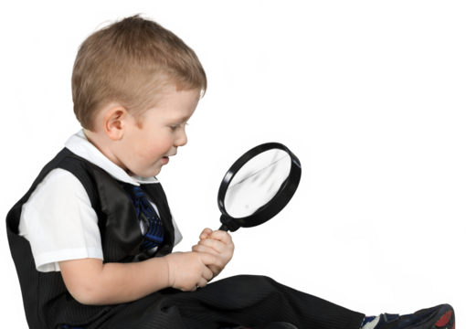 Little cute boy with magnifying glass isolated on white background