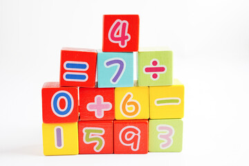 Number wood block cubes for learning Mathematic, education math concept.