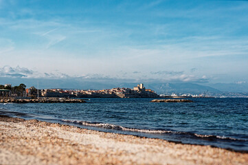 Obraz premium View of the Mediterranean Sea and Fort Carré from Salis beach in Antibes, France