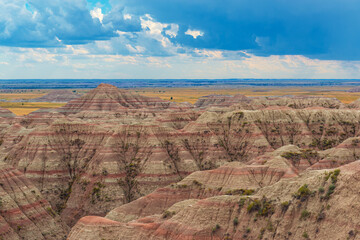 Badlands national park with thunder storm at sunset, South Dakota, USA.