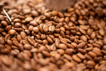 Roasted coffee beans background  colombian coffe rought coffee