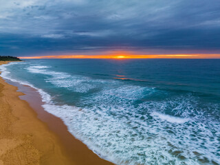 Aerial sunrise at the seaside with cloud cover