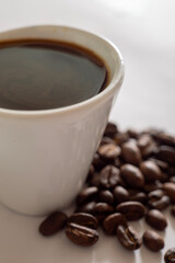 Espresso Coffee Cup With Beans On Vintage Table