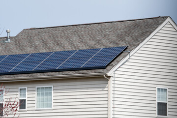 Fototapeta na wymiar Solar photovoltaic panels on a house roof