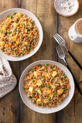 Pineapple fried rice with peas and carrots