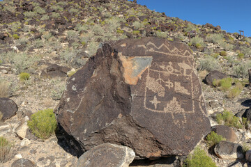 Boca Negra Canyon with petroglyphs carved onto a volcanic rock on the side of West Mesa located at the Petroglyph National Monument Park near Albuquerque New Mexico
