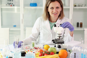 Chemist examines vitamin capsules working in laboratory