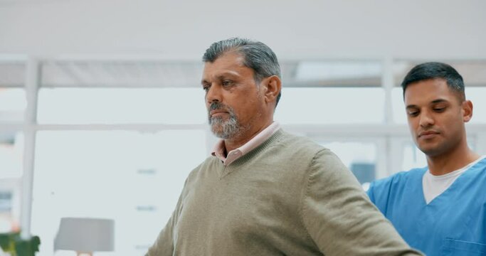 Physiotherapist, senior man and dumbbells in physical therapy for muscle, arthritis or stretching exercise. Physiotherapy, chiropractor or medical person consulting with patient in healthcare support