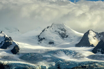 Layers of a blue and white snowy glacier on Elephant Island in Antarctica