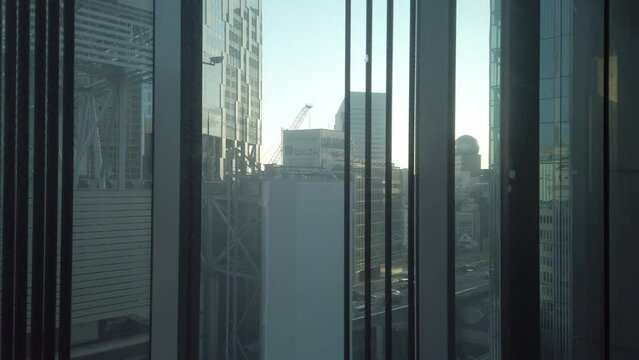 inside moving up down elevator lift in major department store in Tokyo in winter daytime