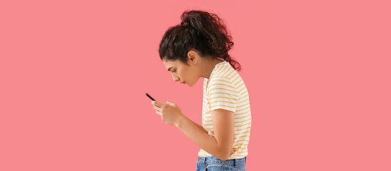Young woman with bad posture using smartphone on pink background - obrazy, fototapety, plakaty