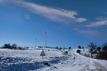 wind turbine on a snowy day