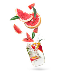 Glass of water and grapefruit slices on white background