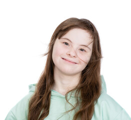 Smiling young girl with Downs syndrom looks at camera. Isolated on white background