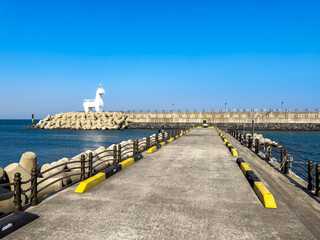 Iho Tewoo Beach, two horse shaped lighthouses at Jeju Island, South Korea