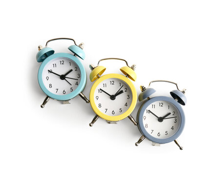 Set of alarm clocks on white background