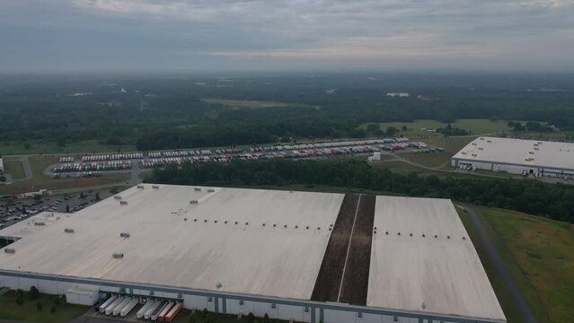 Large industrial warehouses. Road next to them. Adidas warehouses.