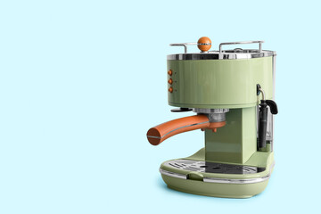 Modern coffee machine on blue background