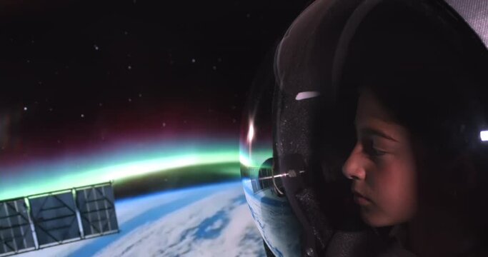 Astronaut Kid's Adventure to the Stars: Earth Reflected in the Helmet's Visor. Technology Related 4K Studio Shot.