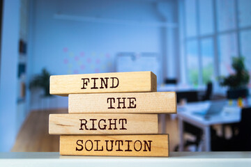 Wooden blocks with words 'Find The Right Solution'. Business concept