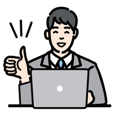 ラップトップの前で笑顔で親指を立てているスーツを着た若い男性
