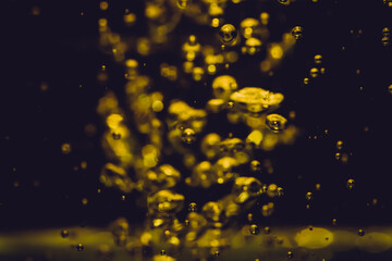 Concept Christmas gold Sparkling Lights Festive bokeh abstract from water twinkled bright bokeh defocused