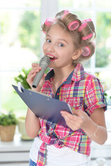 pretty girl with hair curlers with microphone