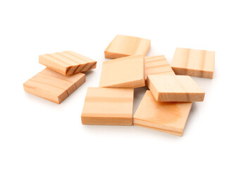Heap of wooden puzzle blocks isolated on white background