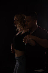 man and woman dance bachata kizomba latina in the dark