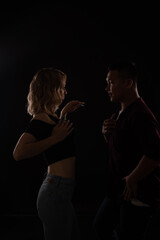 man and woman dance bachata kizomba latina in the dark